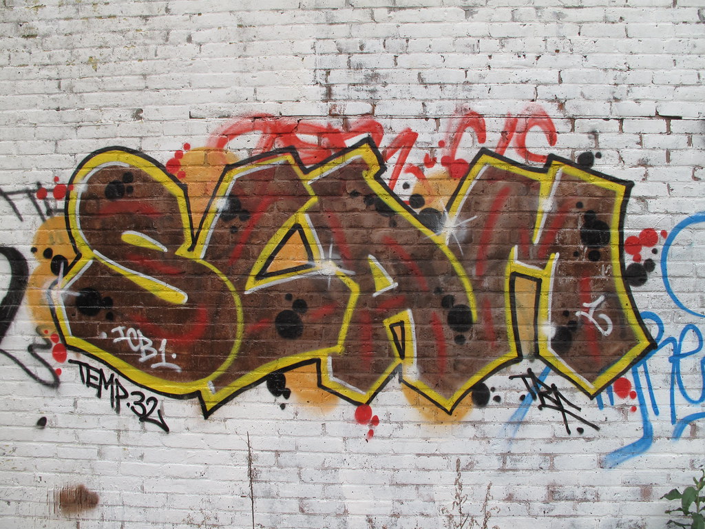 Graffiti of word SLAM on wall